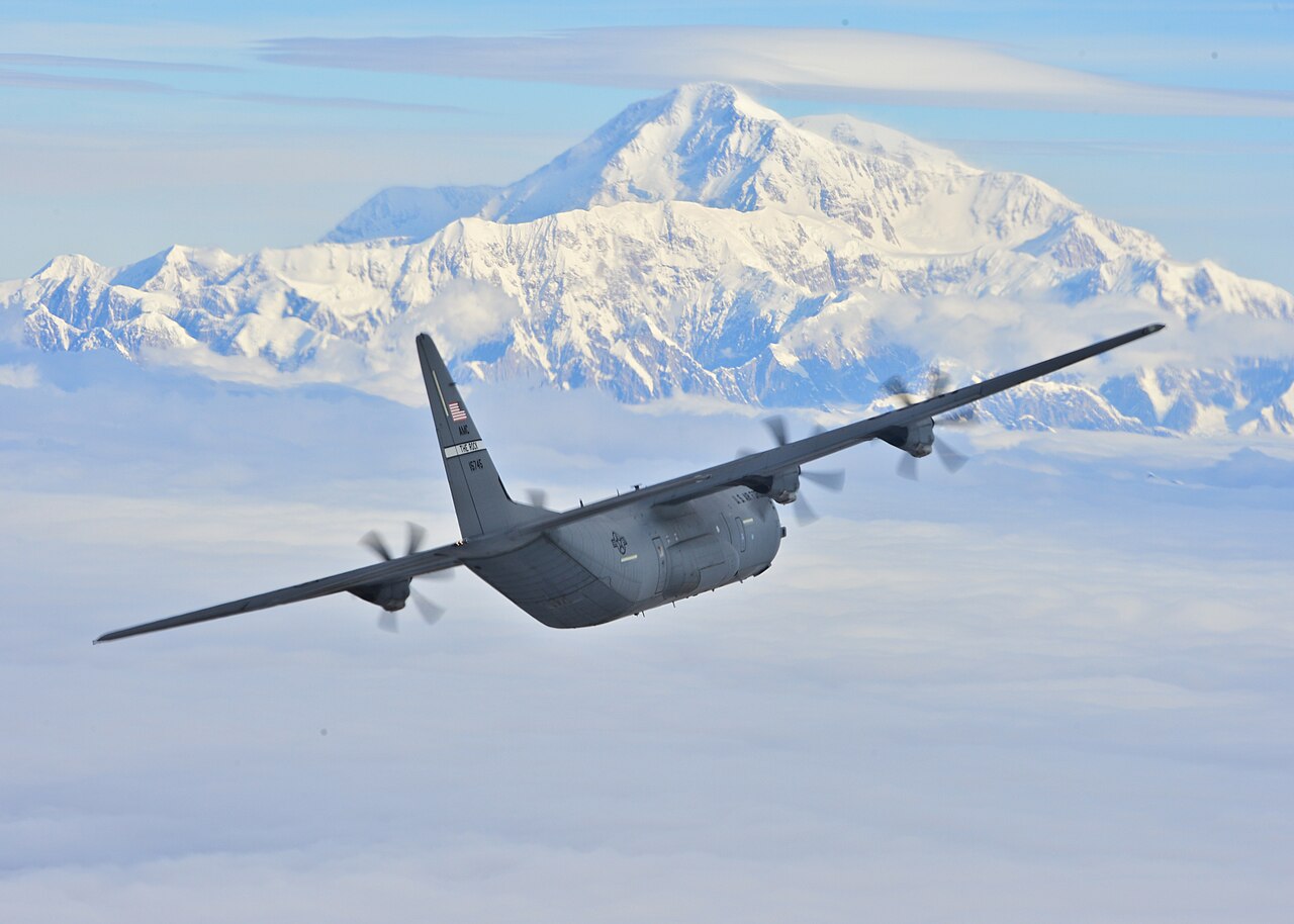 A C-130J Super Hercules from the 41st Airlift Squadron flies past Denali, the highest peak in North America, July 19, 2016. The 41st AS conducted training in Alaska to prepare for the terrain present 