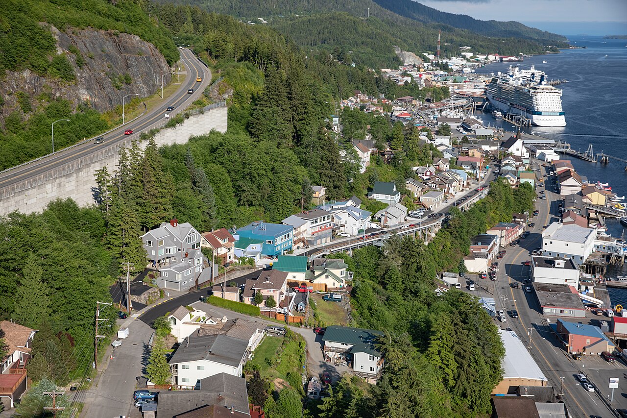 Aerial photo showing the completed Water Street trestle in Ketchikan, Alaska.  Downtown Ketchikan and the cruise ships which visit is seen in the background.  The bypass route along the hillside is se
