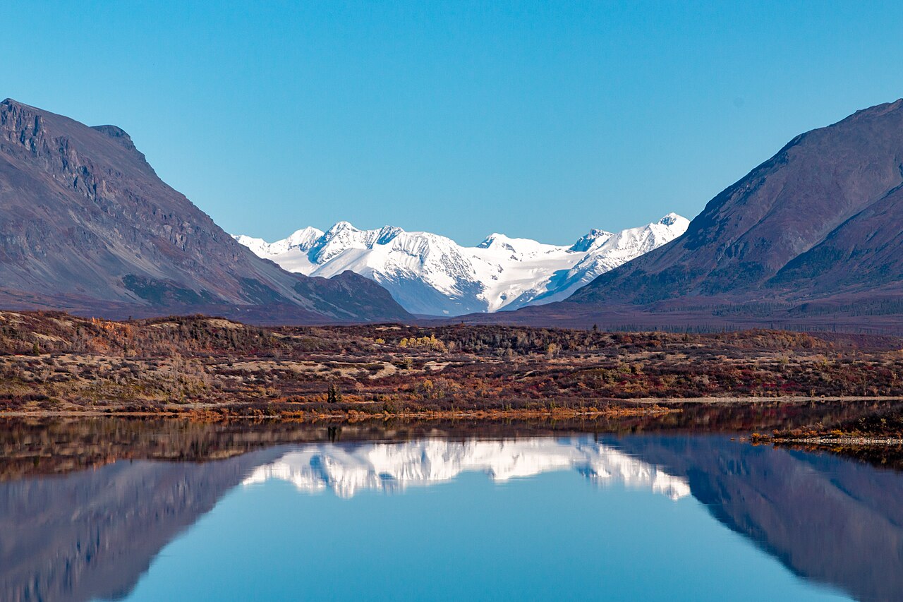 Alaska Range mountains by Landmark Gap are reflected in Upper Tangle Lake, near Alaska's Denali Highway. BLM Alaska photo by Craig McCaa.