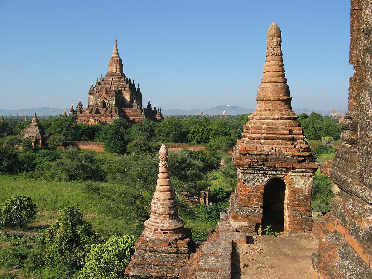 The Htilominlo Temple is three stories tall, with a height of 46m, and built with red brick. It is known for its elaborate plaster moldings. Bagan, Pagan, Myanmar. A UNESCO World Heritage Site.