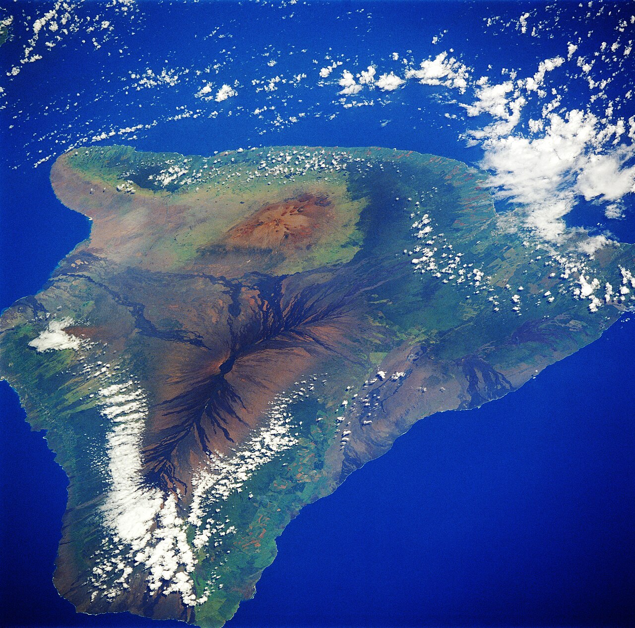 Satellite picture of the island of Hawai'i
Hawaii, the archipelago’s youngest and largest island, is featured in this low-oblique, north-looking photograph. Apparent are the three main volcanoes that 