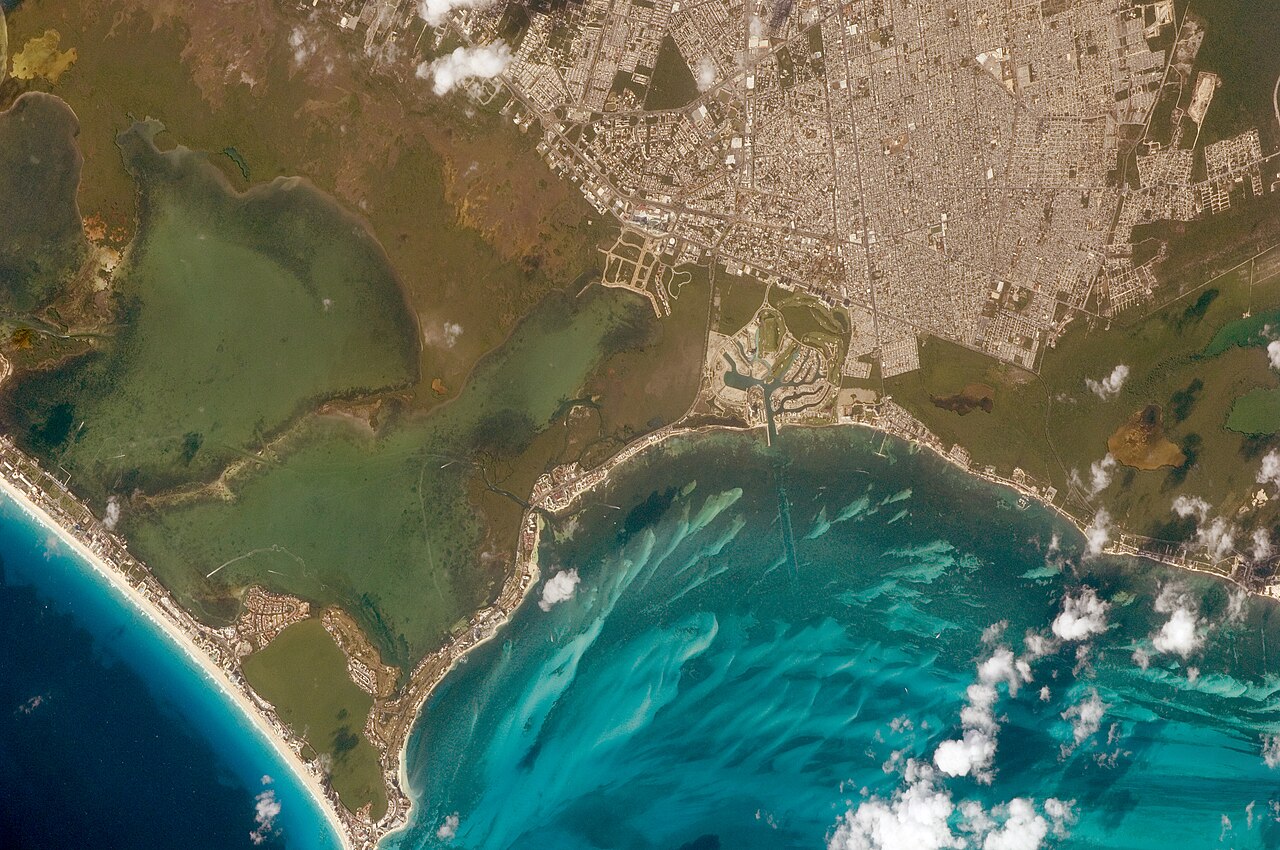 Cancún, Mexico.
A long lens was used by astronauts aboard the International Space Station to take this image, and it highlights many natural and built features. The street pattern of Mexico's tourist 