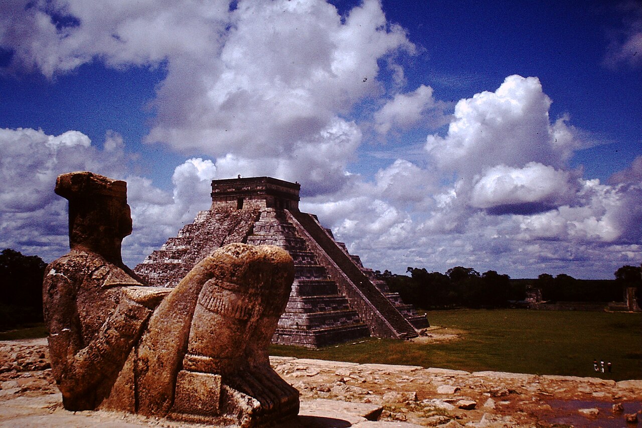 Statue of Chac Mool in Chichén Itzá (today transferred). In the background El Castillo. Photo taken 1984 with a Minox miniature camera.