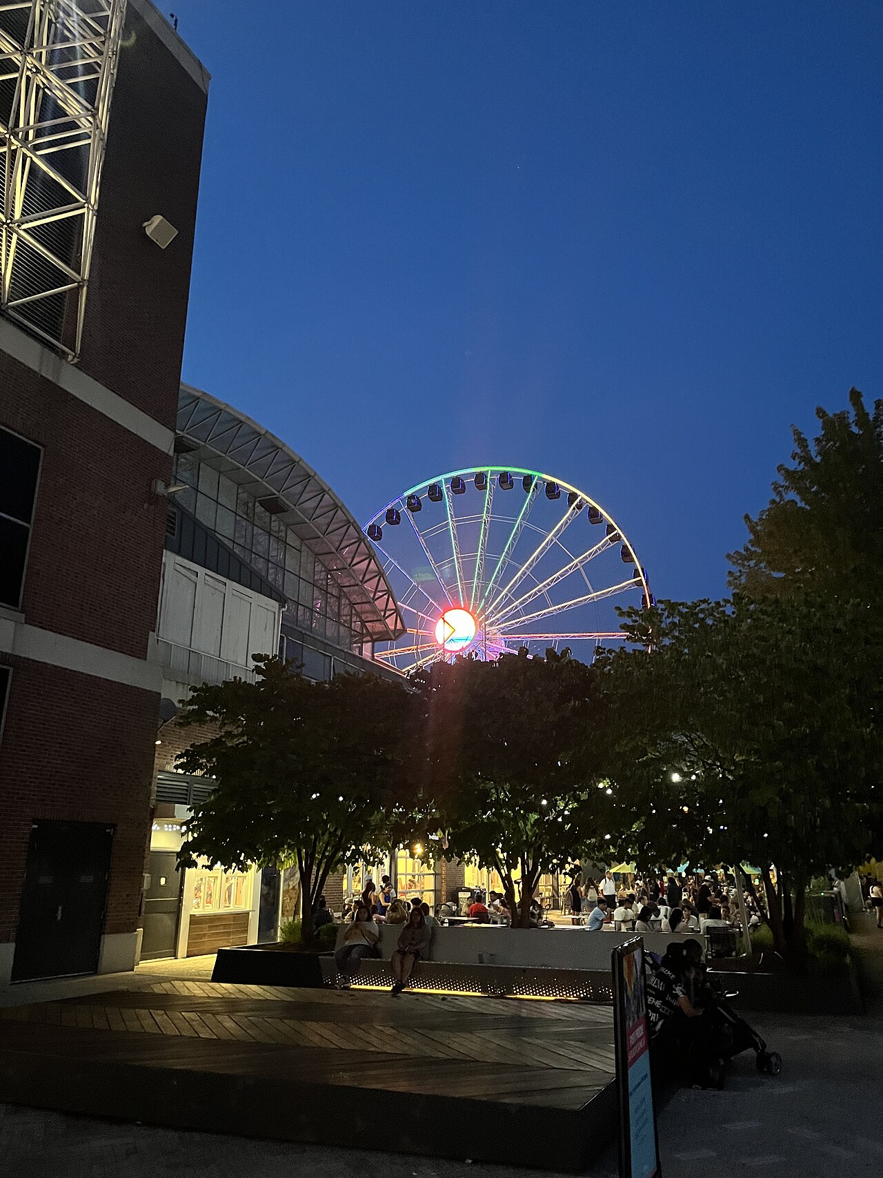 A picture of the Centennial Wheel in Navy Pier, Chicago, Illinois, with rainbow lights for Pride Month.