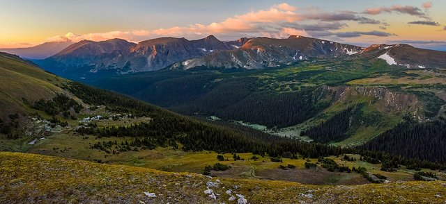This is a view of Forest Canyon in  Rocky Mountain National Park from Trail Ridge Road at sunrise. Mount Julian centered in the distance with Terra Tomah Mountain left of center.