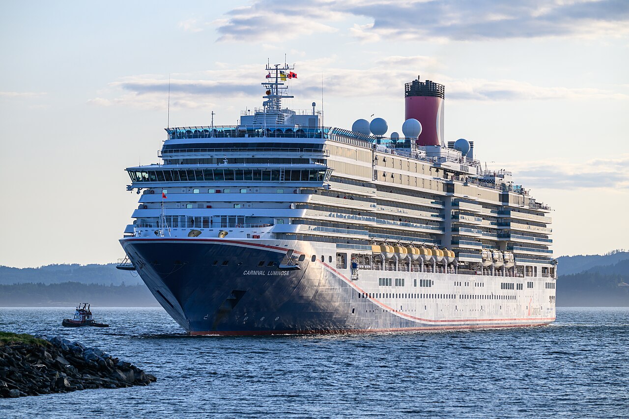 Cruise ship, CARNIVAL LUMINOSA - IMO 9398905, MMSI 311001201 with Seaspan ULC tugboat, CHARLES H. CATES IV - MMSI 316005724, docking at Ogden Pier B, Victoria BC Canada on June 4, 2025.