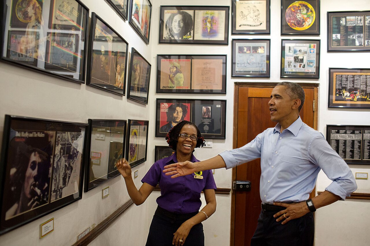 President Barack Obama looks at memorabilia with museum guide Natasha Clark at the Bob Marley Museum in Kingston, Jamaica, April 8, 2015. (Official White House Photo by Pete Souza)