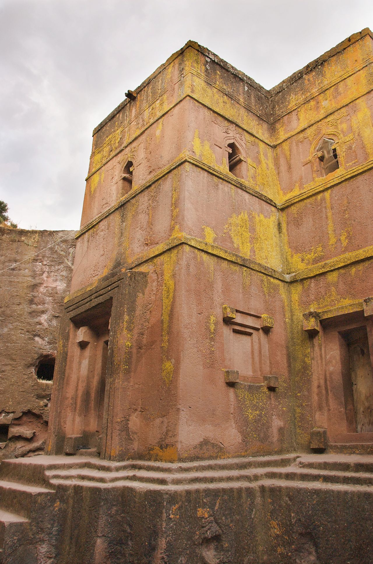 This photo of the entrance to the 13th century rock-hewn Church of Bet Giorgis captures the building's cross-shaped design better than the previous one.
What's remarkable is the size of the open space