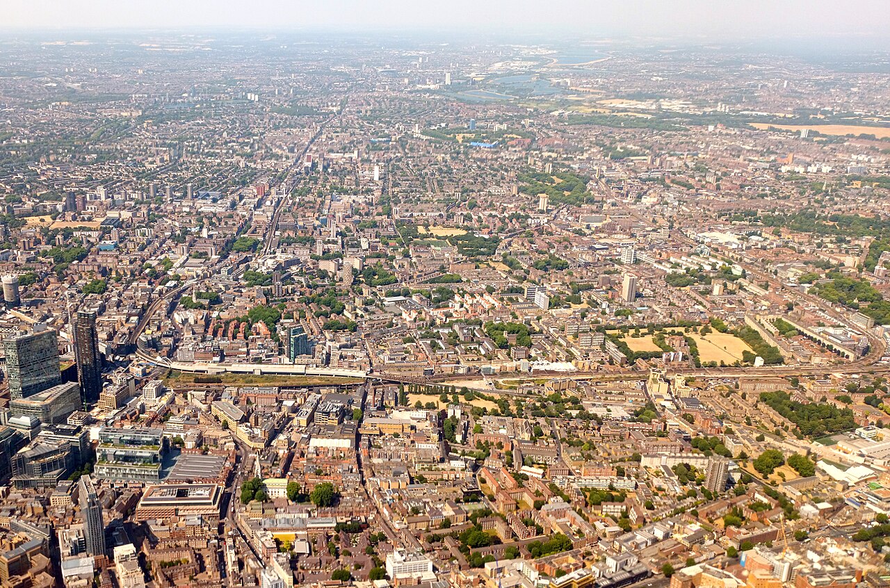 Aerial photograph of east London. Shoreditch is visible, with Bethnal Green and Haggerston centre right and Bishopsgate just visible in the left foreground.
