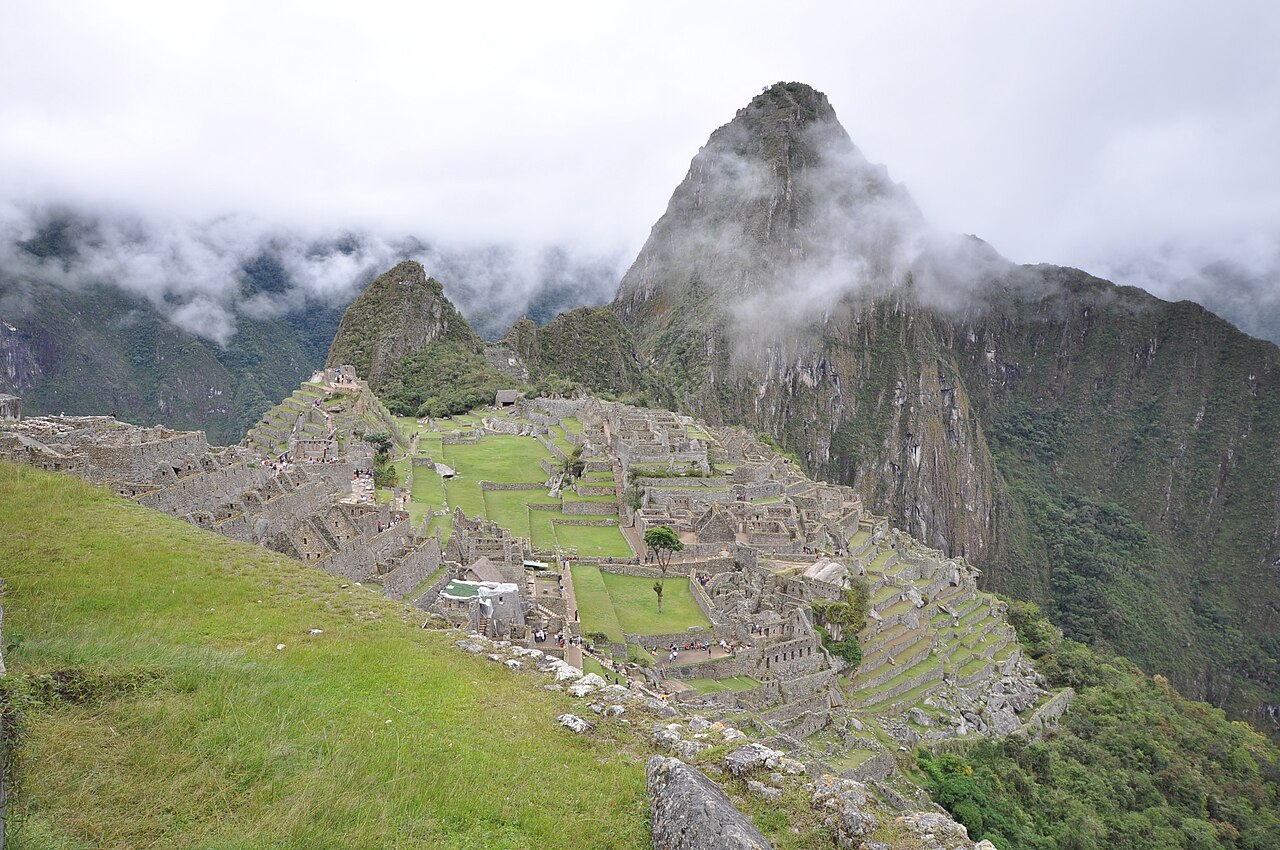 Machu Picchu (Quechua: Machu Pikchu, "Old Peak") is a pre-Columbian Inca site located 2,430 metres (8,000 ft) above sea level. It is situated on a mountain ridge above the Urubamba Valley in Peru, whi