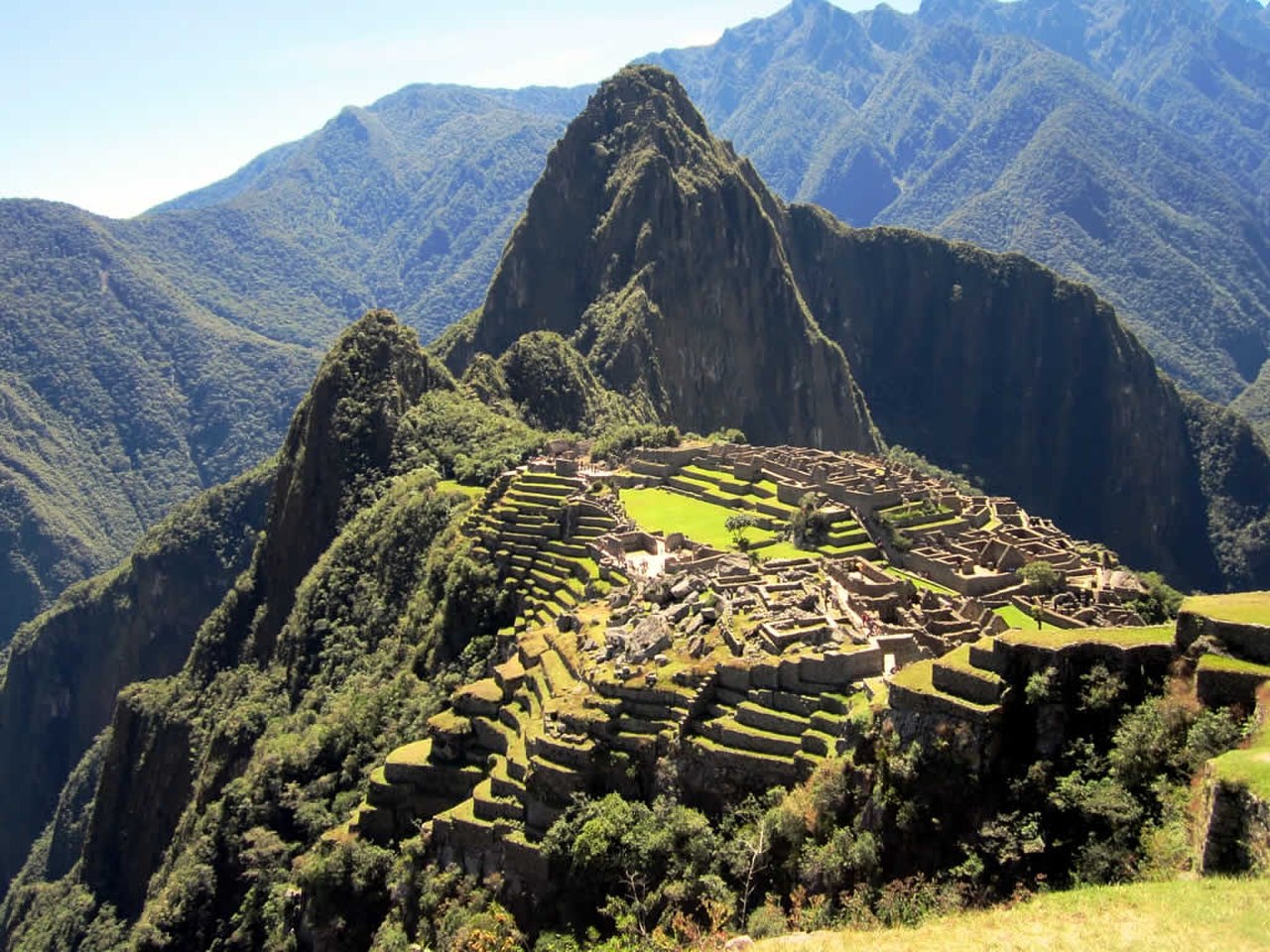 Sugarloaf-shaped Huayna Picchu towers above the Lost City of Machu Picchu, Peru.