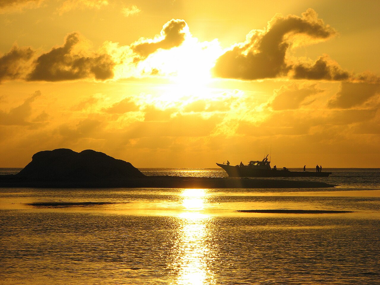 HIthadhoo, Addu Atoll, Maldives. A fishing boat arriving with an early catch.