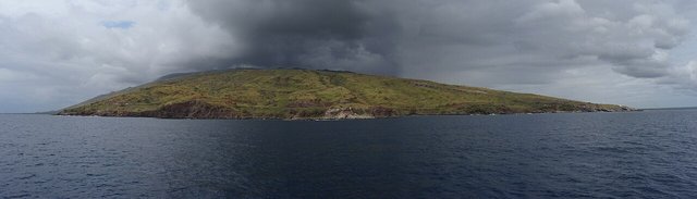 A panorama of Maui in Hawaii showing the West Maui Mountains.  

Taken from a boat near Lahaina.
Four photos stitched together with DoubleTake, minor contrast adjustments done in iPhoto.