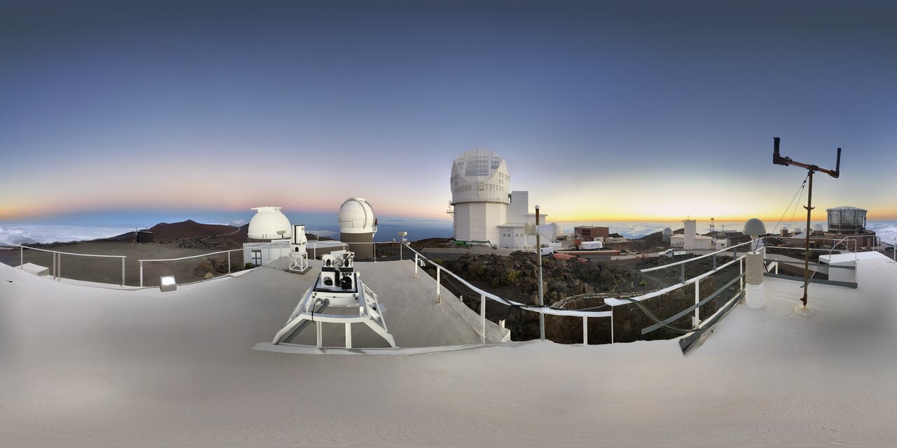 This panorama shows a group of observatories at the summit of Haleakalā on the Hawaiian Island of Maui. The largest telescope at the center is the Daniel K. Inouye Solar Telescope.