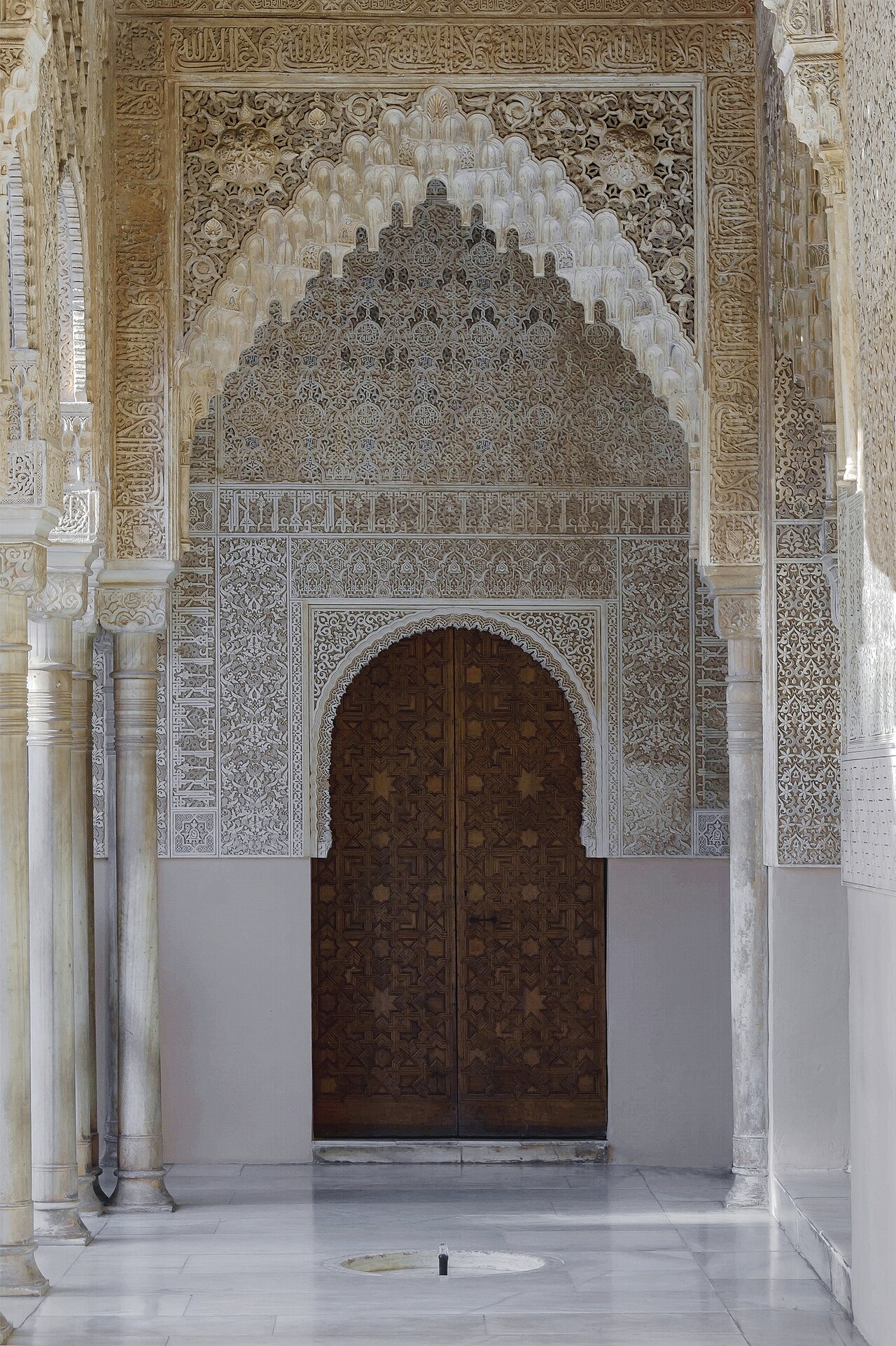 A door and a fountain, Patio de los Leones, Alhambra, Granada, Spain.