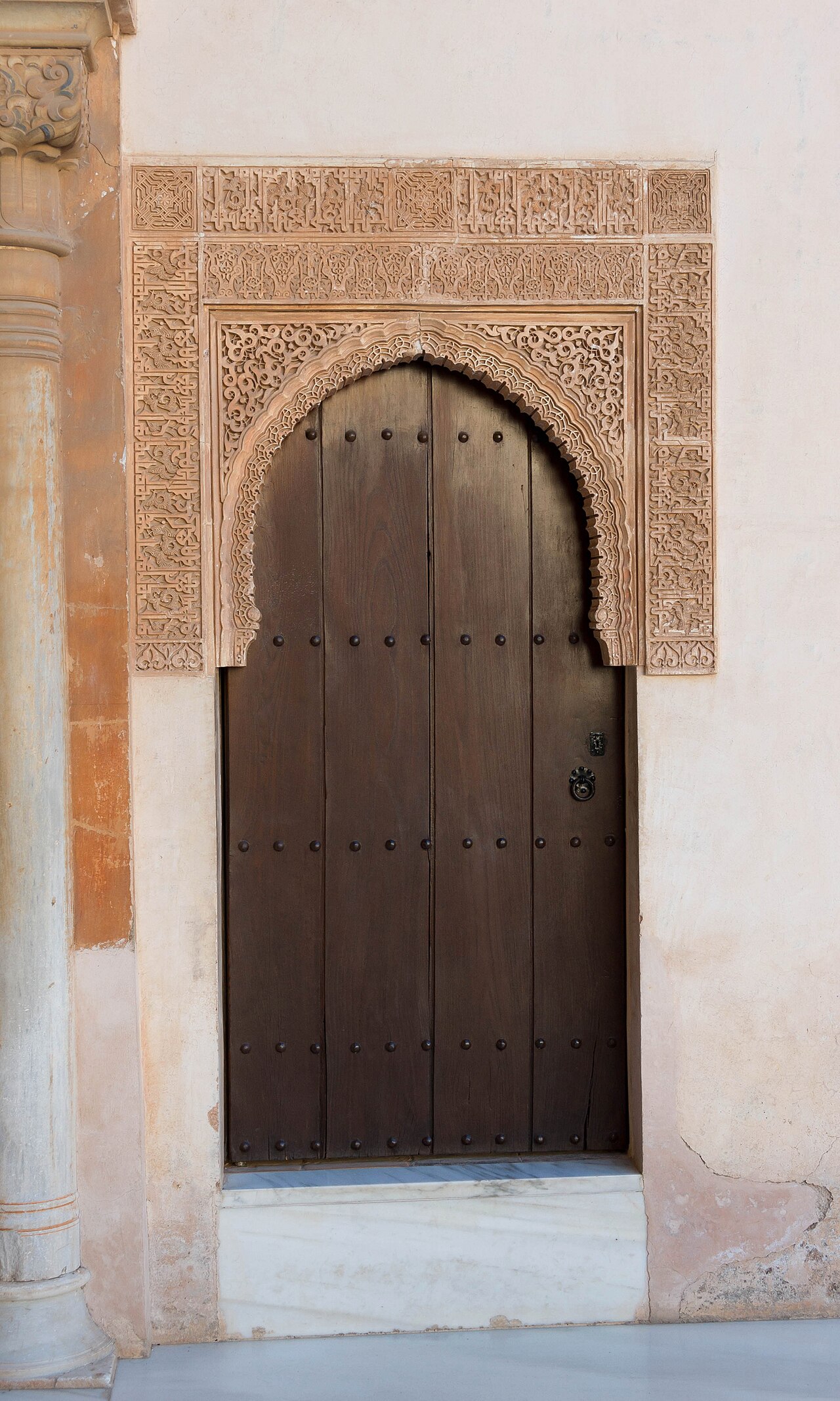 A wooden door in the patio de los Arrayanes ("Myrtle courtyard"), Alhambra, Granada, Spain.