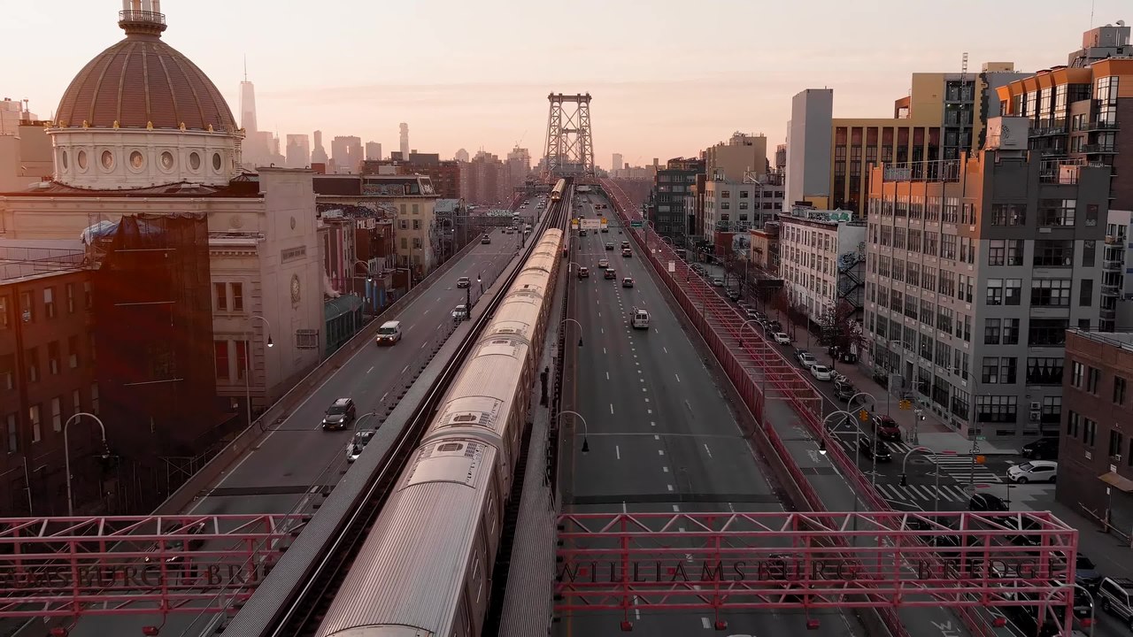 Aerial view of MTA Subway trains on the Williamsburg Bridge, East River, Downtown Manhattan, Williamsburg (Brooklyn), 420 Kent Avenue, Brooklyn Shipyard, Williamsburg Bank, New York City, USA.