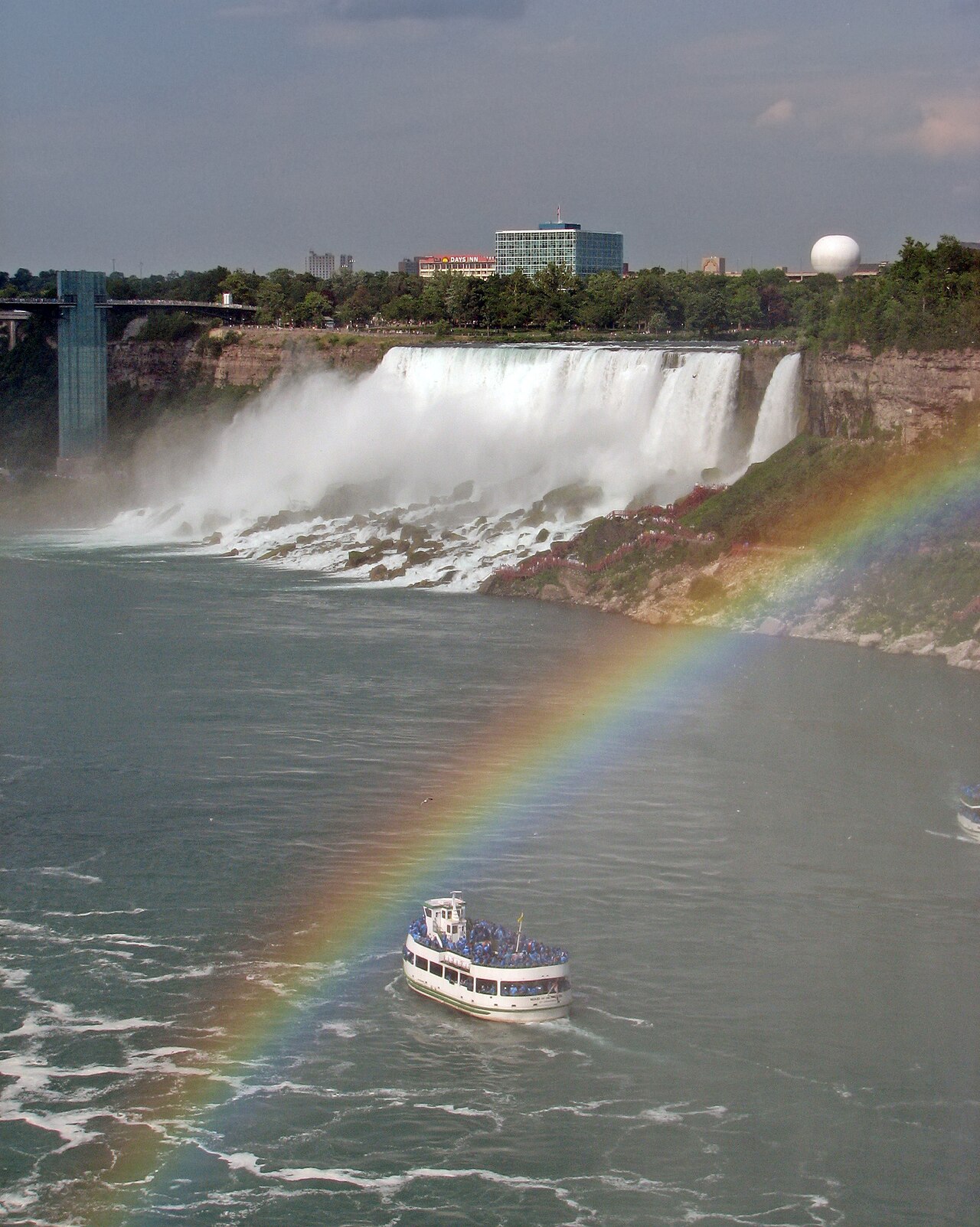 The American Niagara Falls, with a rainbow and one of the Maid of the Mist boats.