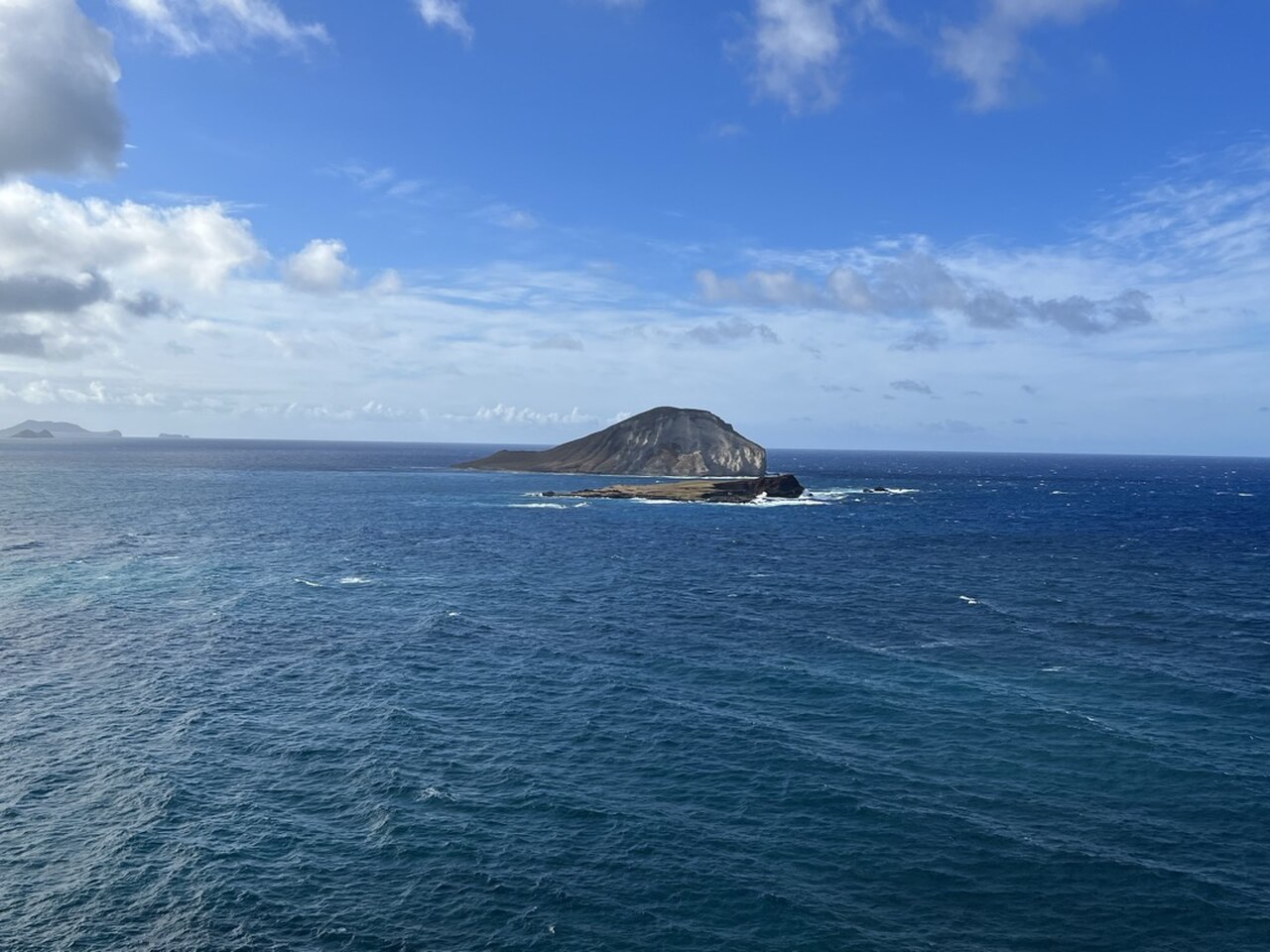 A view of two small Hawaiian islands as seen from the coast of Oahu