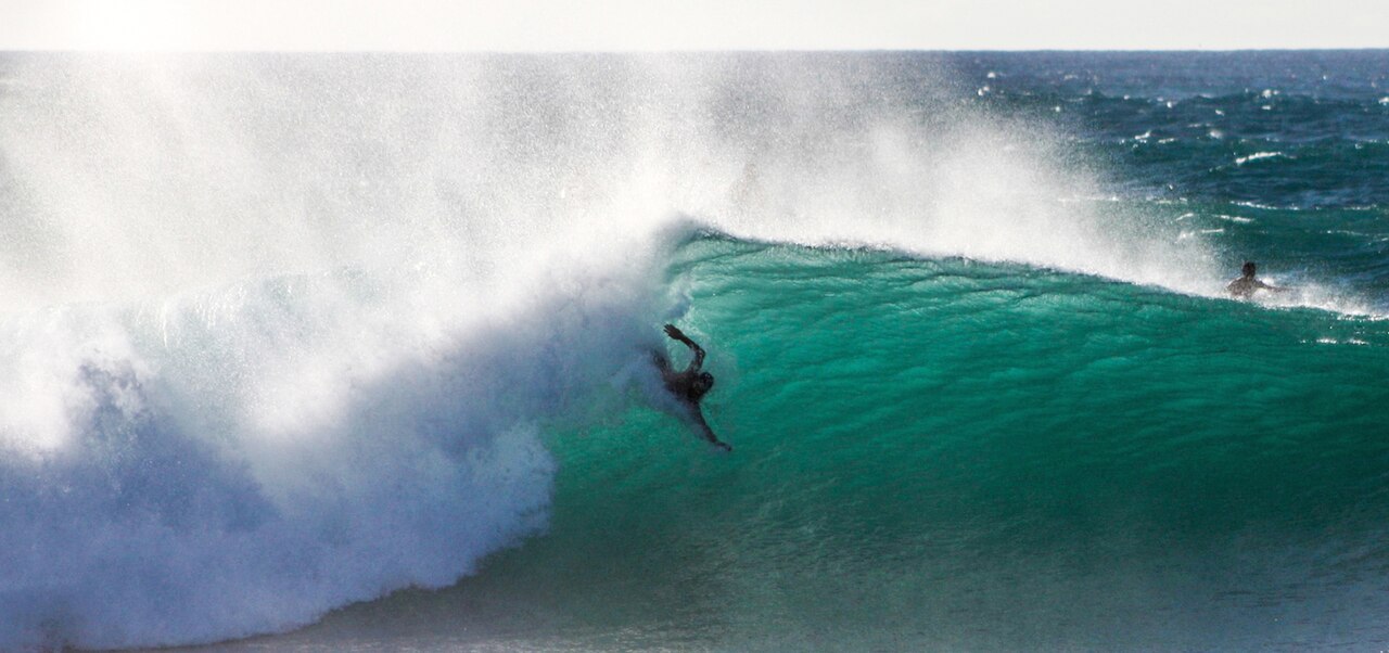 Bodysurfer Travis Overley no a wave at Pipeline. Shot by Rachel Newton-Joyce on October 28, 2013.
