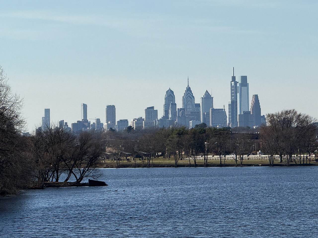 The skyline of Philadelphia, Pennsylvania viewed from the County Route 636 (Cuthbert Boulevard) bridge over Cooper River Lake on the border of Haddon Township and Cherry Hill in New Jersey