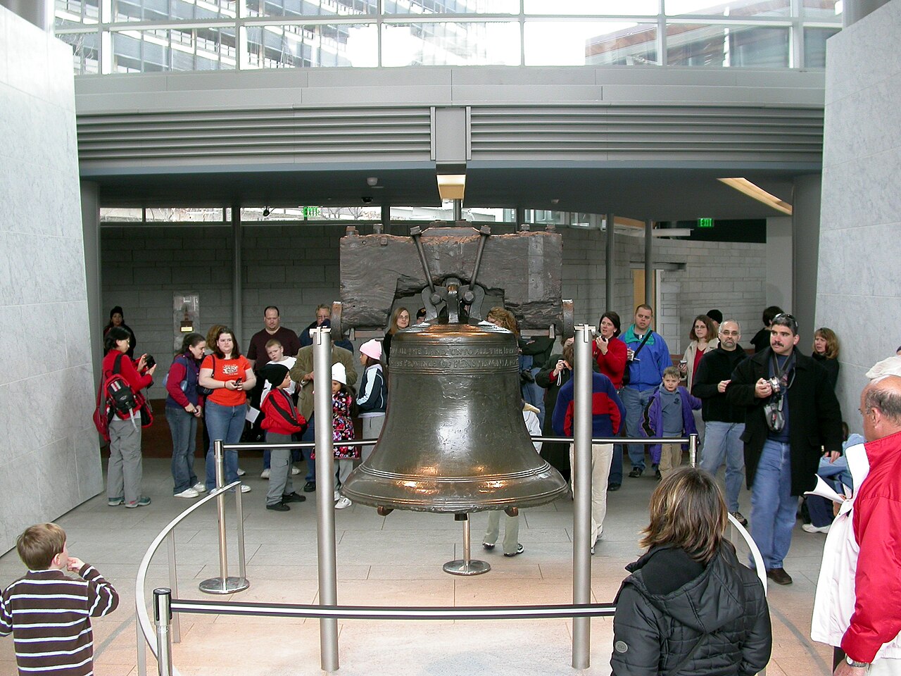 Visitors view the Liberty Bell inside the Liberty Bell Center at Independence National Historical Park in Philadelphia, Pennsylvania, United States.