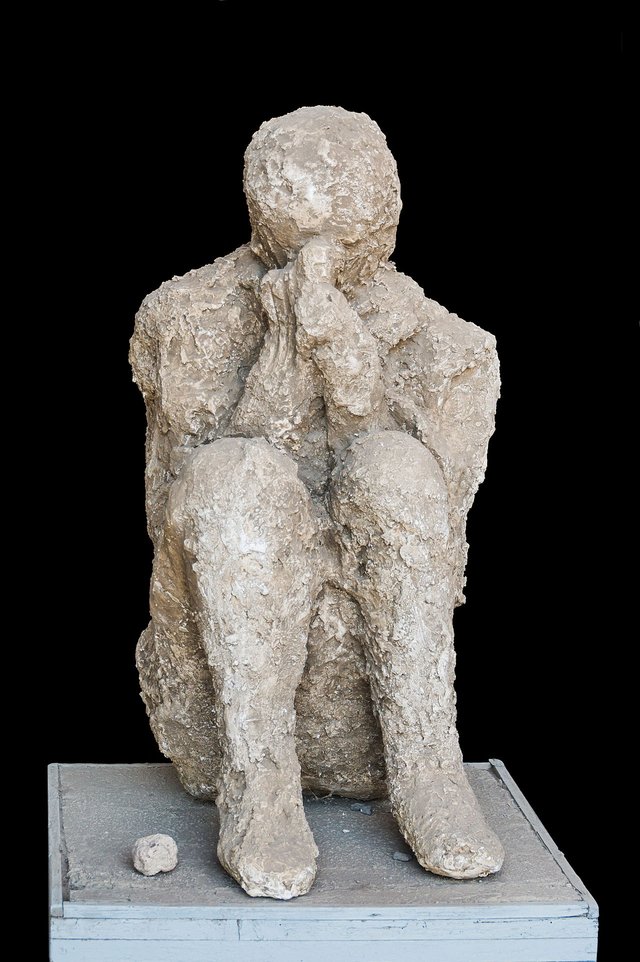 Cast of a sitting victim of the eruption of Mount Vesuvius, 79 CE, Pompeii, Italy.