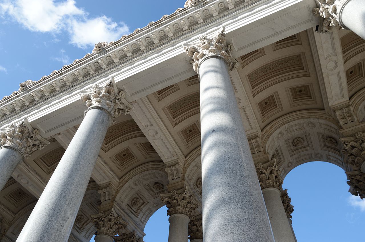 Colonnades of and sky above Basilica of Saint Paul Outside the Walls (Rome, Italy).