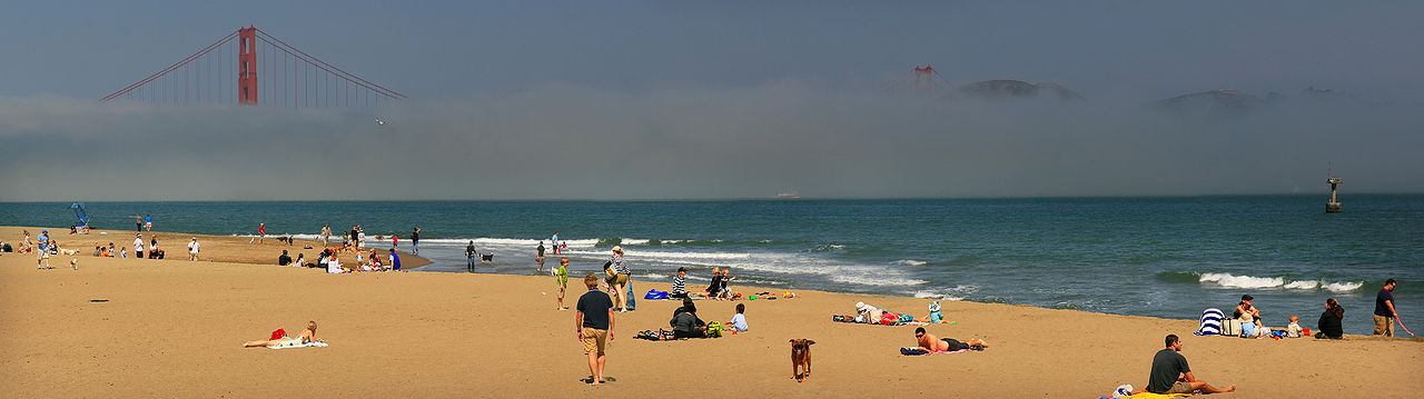 Crissy Field beach on San Francisco Bay with Golden Gate Bridge. The bridge is obscured by famous San Francisco fog.