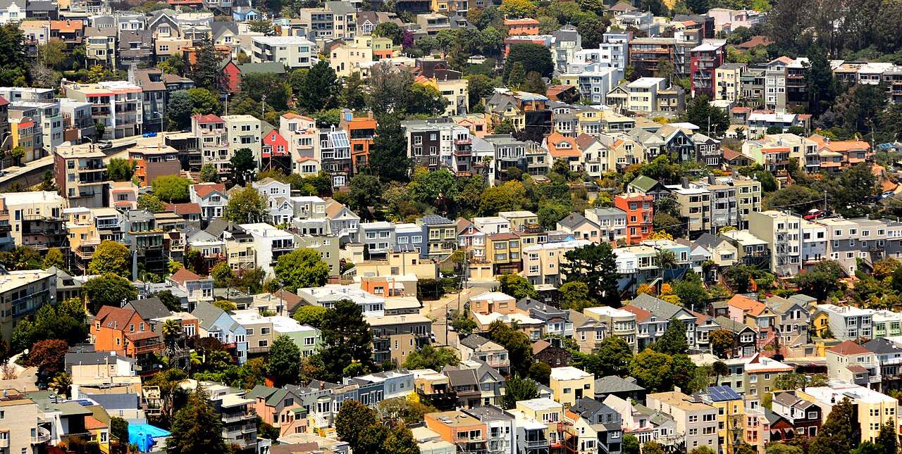My photo of houses in San Francisco was taken from Twin Peaks which provide a panorama for sightseers and photographers.  

It illustrates the type of housing and the density of this city with a popul