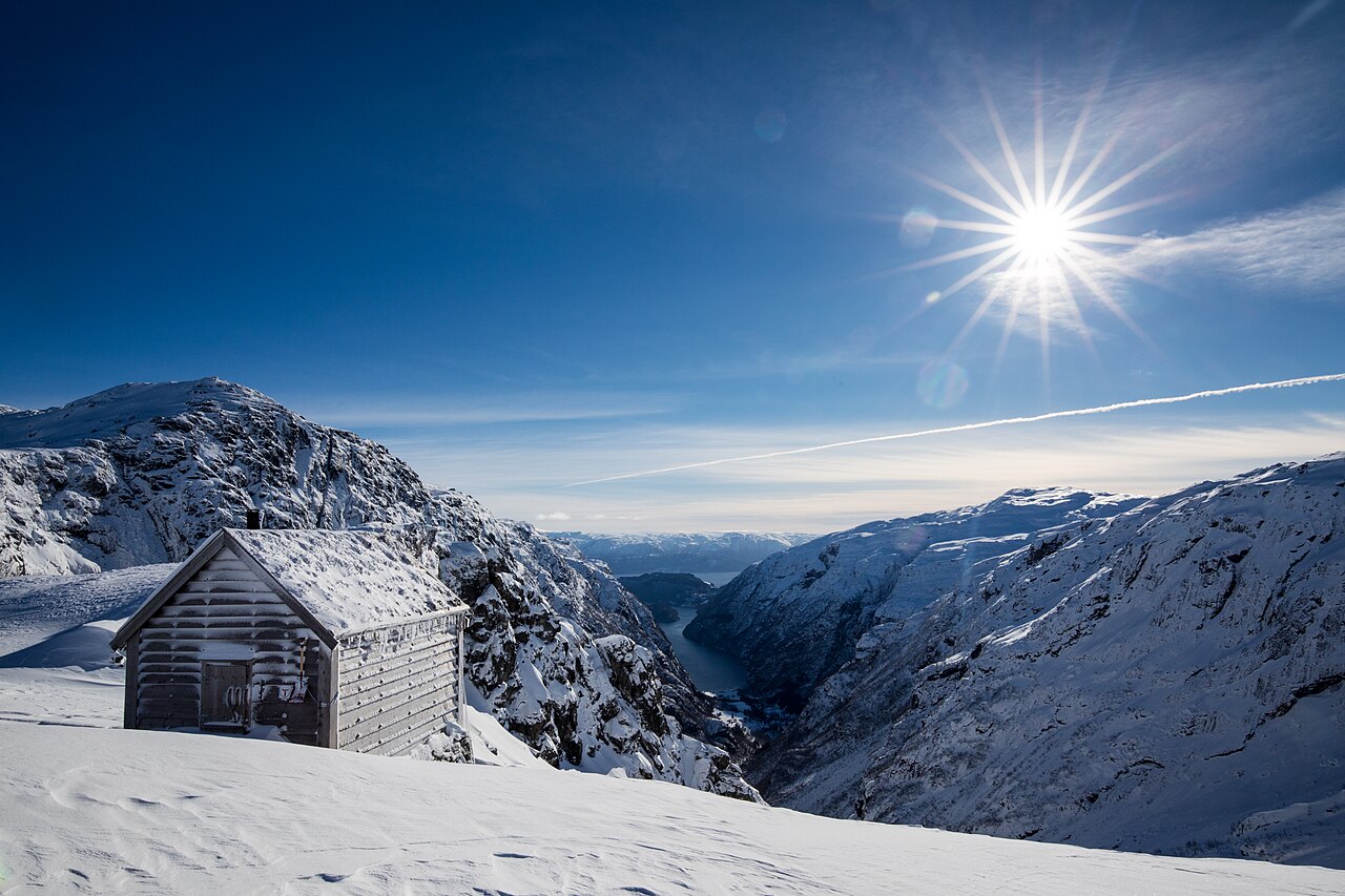 View from Sveindalseggi in Kvam, Hordaland in Western Norway. The cottage to the left is «Kiellandbu», one of Den Norske Turistforenings unattended cabins which are open for use all year. The fjord in