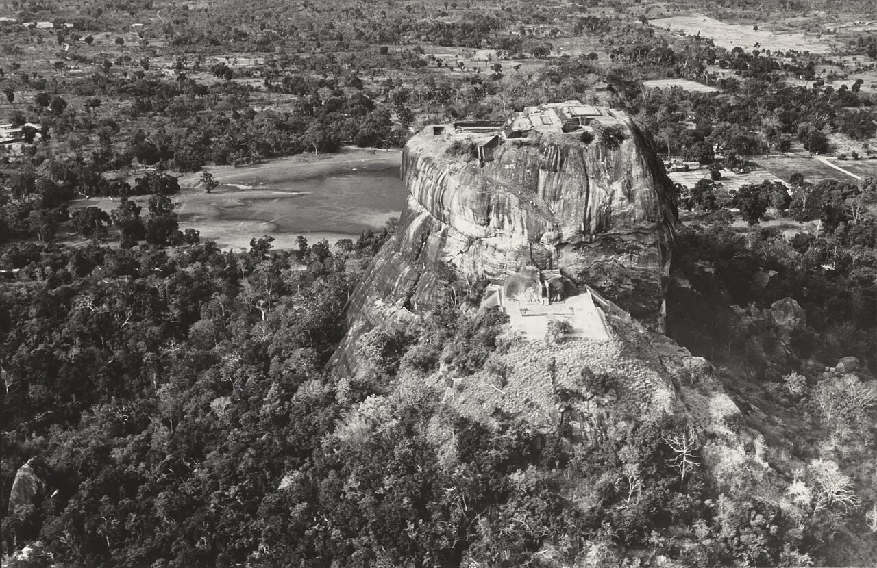 UNESCO aerial photograph of Sigiriya showing the summit palace ruins, terraced levels, and surrounding landscape.