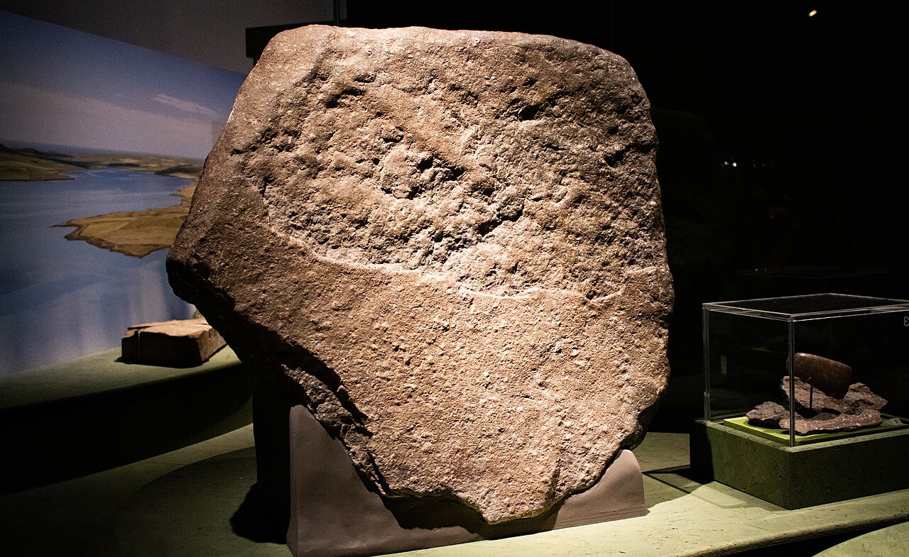 A large piece of dressed Welsh bluestone, likely to have been part of the first monument at Stonehenge. The stone is here on display at the British Museum in their World of Stonehenge exhibition.