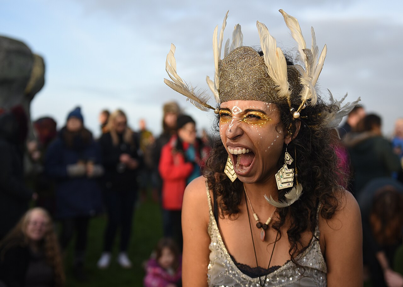 A woman celebrates after the winter solstice at Stonehenge, England, Dec. 22, 2018. Stonehenge, a United Nations Educational, Scientific and Cultural Organization World Heritage site, has been a place