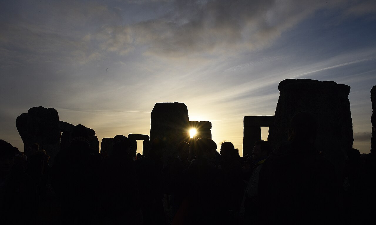 The sun rises following the winter solstice at Stonehenge, England, Dec. 22, 2018. Each year, thousands of people visit to celebrate the summer and winter solstices in and around the stone circle. (U.