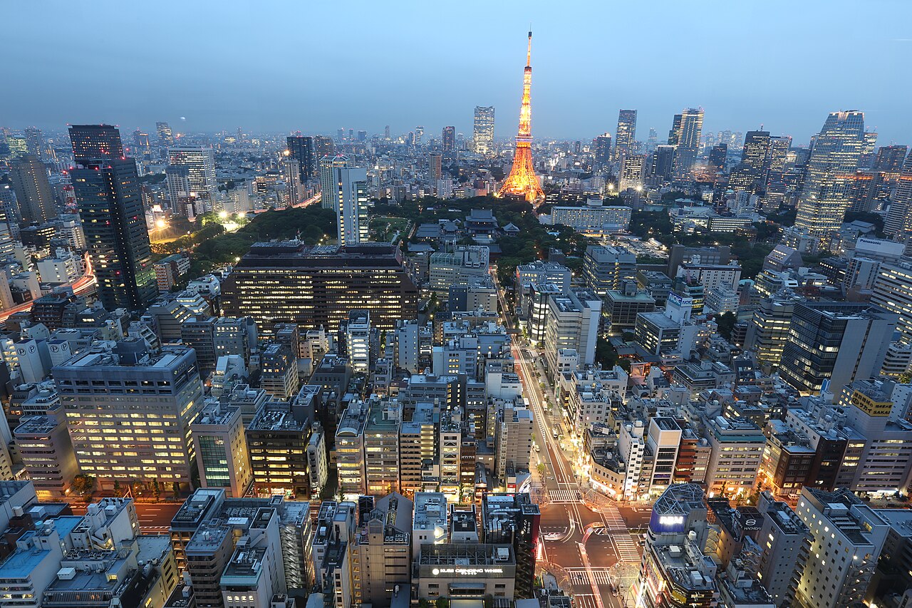 Aerial drone shot at dusk of Shiba-koen district, Minato, Tokyo, with the Tokyo Tower lit up.