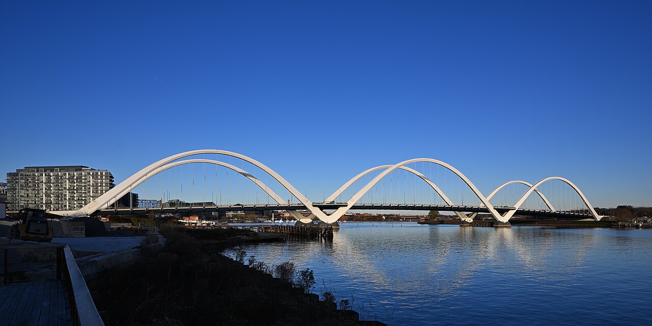 The view of the Frederick Douglass Memorial Bridge and the Anacostia River as seen from the southwest. This through arch bridge carries South Capitol St SE across the Anacostia River in Washington, DC