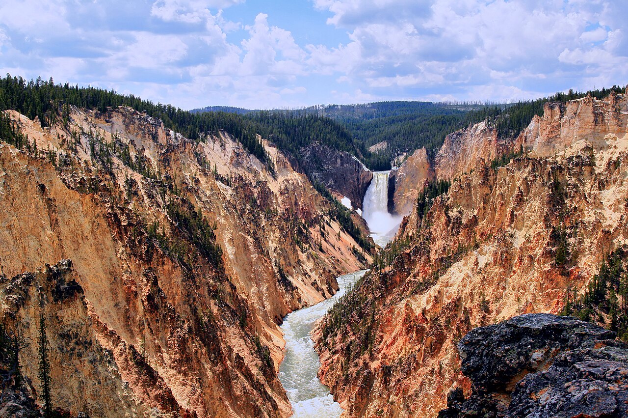 Grand Canyon and Yellowstone Fall at Yellowstone National Park. The canyon is up to 900 feet deep (275 m) and a half mile (0.8 km) in width. The canyon below the Lower Yellowstone Falls was at one tim