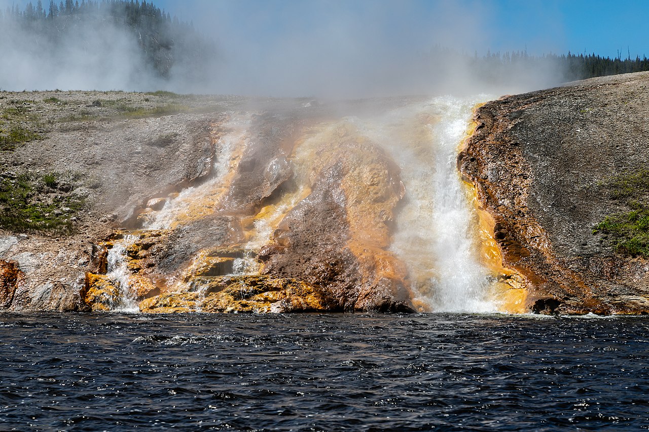 Hot waterfalls in the runoff channels of Excelsior Geyser into the Firehole River in Yellowstone National Park, Wyoming, USAYellowstone National Park was founded on March 1, 1872, and is considered th